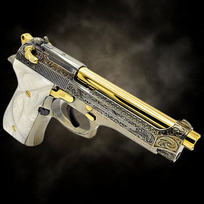 Custom Beretta 92FS 9mm pistol with French scroll engraving, a black chrome and polished finish, and 24K gold accents.