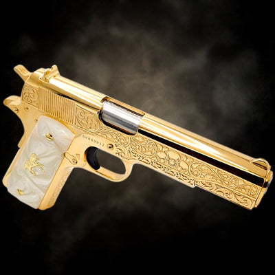 Custom Colt 1911 .38 Super pistol, fully 24K gold plated with Skulls & Scroll engraving and white pearl grips.