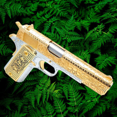 Custom Colt 1911 .45 ACP "Skulls & Scrolls" engraved pistol with 24K gold slide and 18K white gold frame.