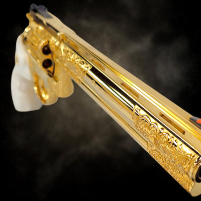 Angled view of the 24K gold plated 8-inch barrel with engraving detail.