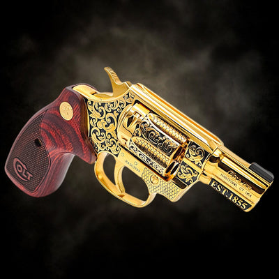 Custom Colt Cobra 2-inch revolver, fully 24K gold plated with Colt Heritage scroll engraving and rosewood grips.