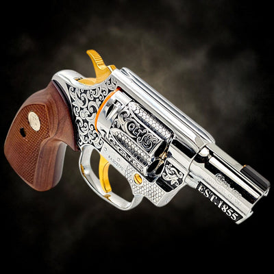 Custom Colt Cobra 2-inch .38 Spl revolver with Colt Heritage engraving, polished finish, 24K gold accents, and walnut grips.