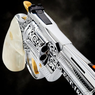 Custom Colt Python 3-inch revolver, fully 24K gold plated with Colt Heritage engraving and White Pearl grips.