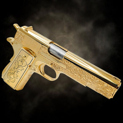 Custom Springfield 1911-A1 .45 ACP pistol with a full 24K gold plated finish and French scroll engraving.